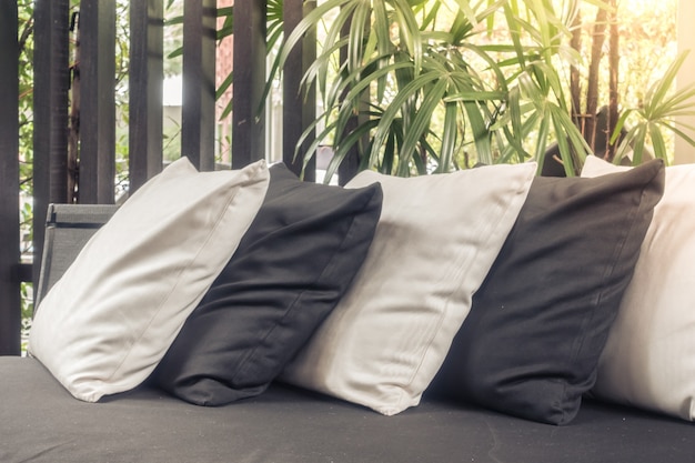 Free Photo black and white pillows on a couch