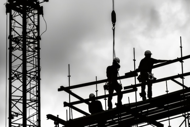 Free photo black and white scene showcasing the life of construction workers on the site