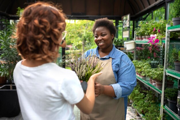 Black woman running a flower business medium shot