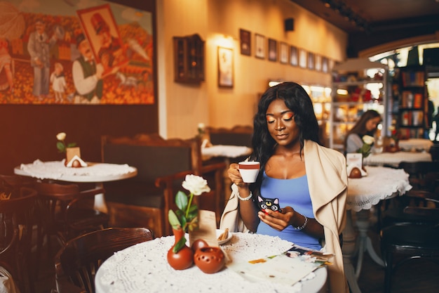 Black woman sitting in a cafe