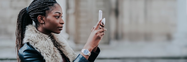 Black woman taking a photo