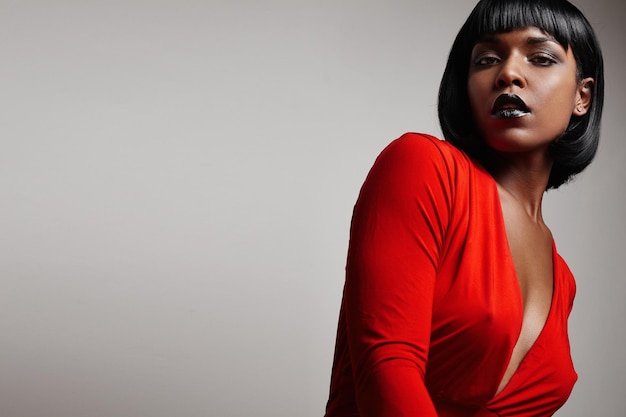 Free Photo black woman with a straight short hair wearing red dress