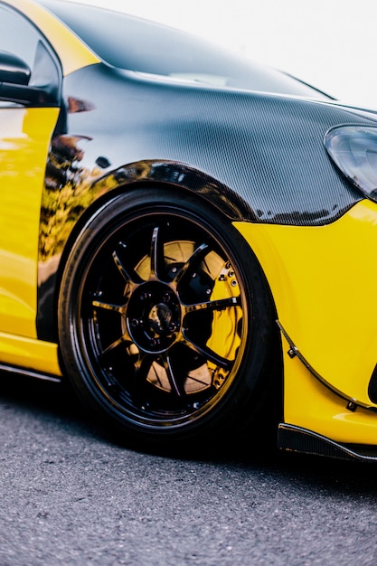 Black yellow car and wheel autotuning.