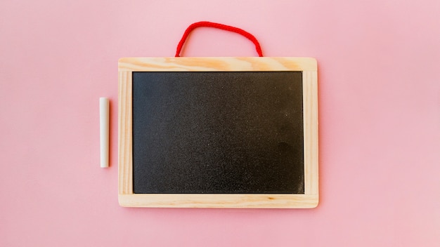 Free photo blackboard in frame with chalk