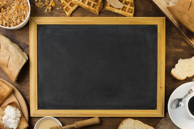 Blackboard surrounded by breakfast 