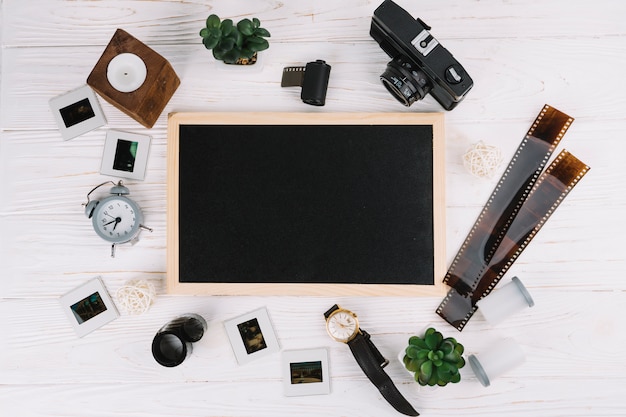 Free photo blackboard surrounded by photography elements