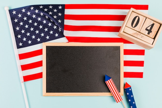 Blackboard with flag and firecrackers