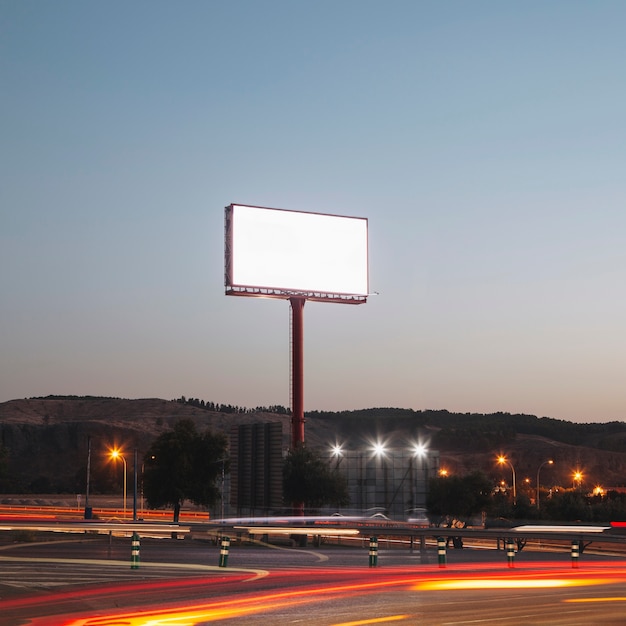 Free photo blank advertising billboards on the illuminated highway at night