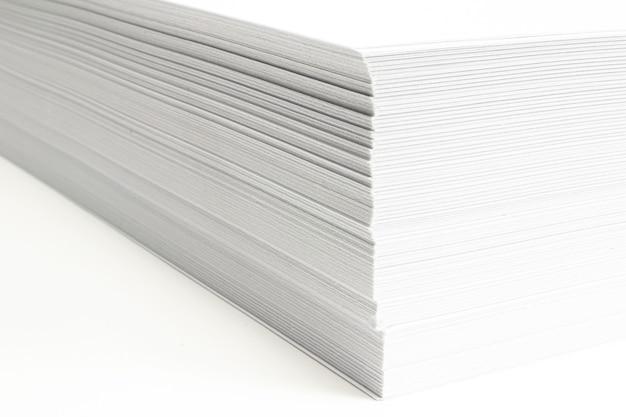 Free Photo blank ar letterheads stack macro view with selective focus on white background.