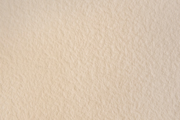 Blank beige textured wallpaper background