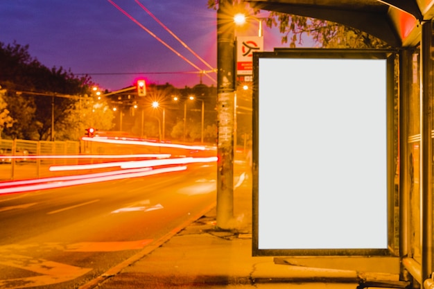 Free photo blank billboard on bus stop at night