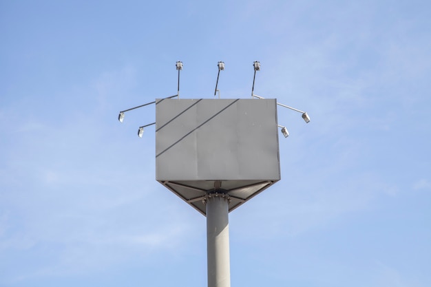 Free photo blank billboard with lights against blue sky