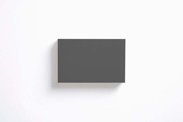 Free photo blank black business cards stack isolated on white. clear template to showcase your presentation.