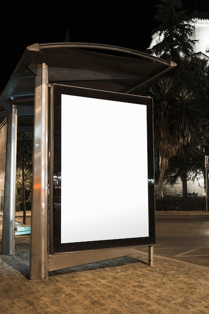 Free Photo blank bus stop advertising billboard in the city at night