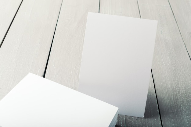 Blank business cards on a wooden background