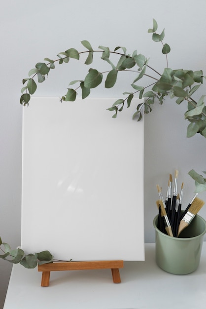 Free photo blank canvas for painting indoors still life