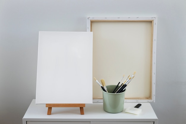 Free photo blank canvas for painting indoors still life