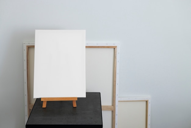 Free photo blank canvas for painting indoors still life