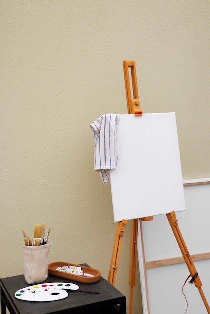 Free photo blank canvas for painting indoors still life