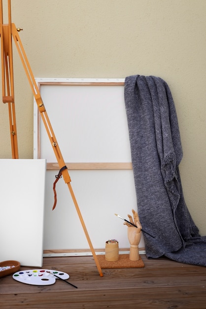 Free photo blank canvas for painting indoors still life