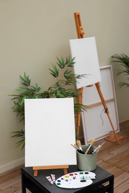 Free photo blank canvas for painting indoors still life