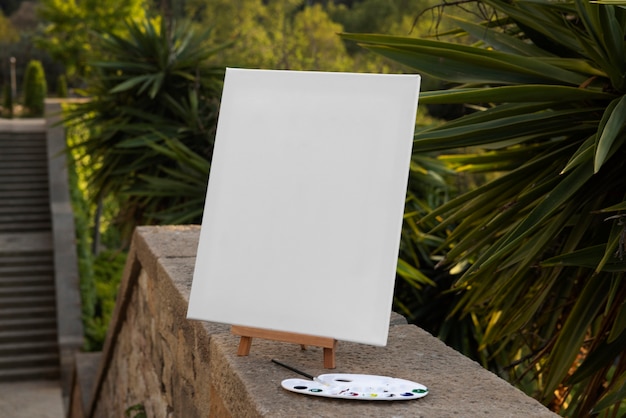 Free photo blank canvas for painting outdoors still life