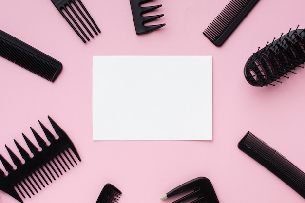 Blank card surrounded by hairdressing tools