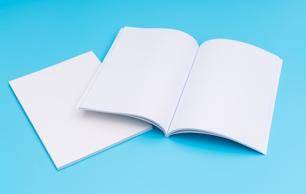 Free photo blank catalog, magazines,book mock up on blue background. .