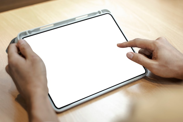 Blank digital tablet on a light wood table