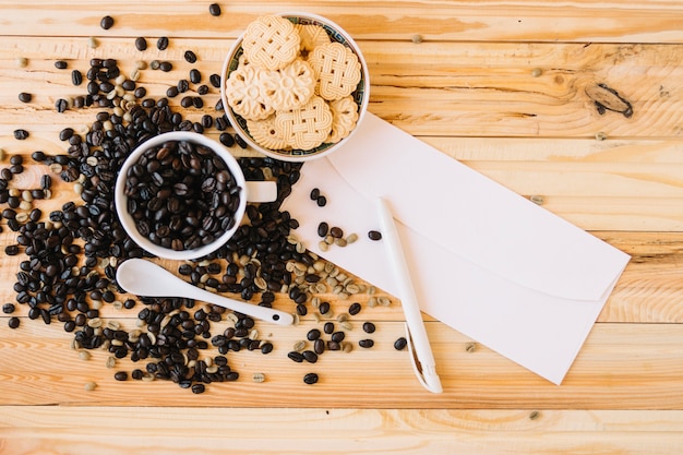 Blank envelope near cookies and coffee beans