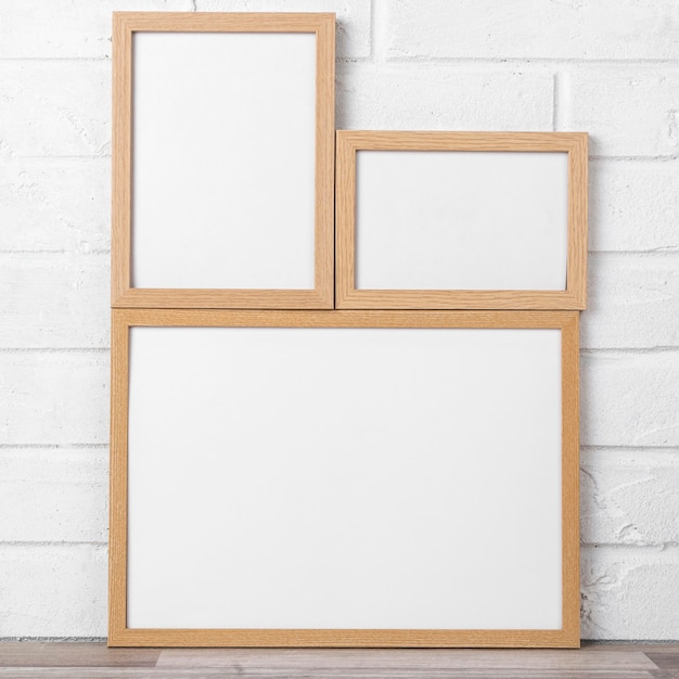 Free photo blank frame collection on shelf