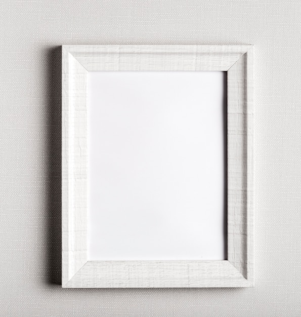 Free photo blank frame on simple white wall