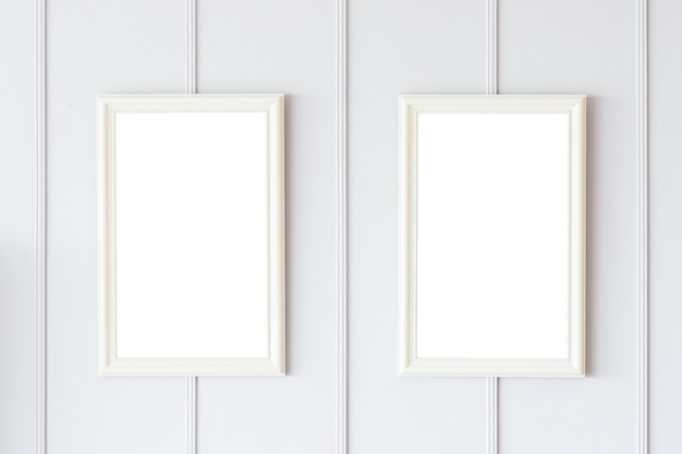 Blank frame on white wall background