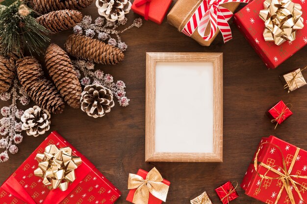 Blank frame with gift boxes and cones 