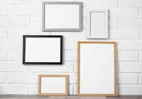 Free photo blank frames on wall