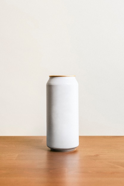 Free photo blank minimal white tin can on wooden floor