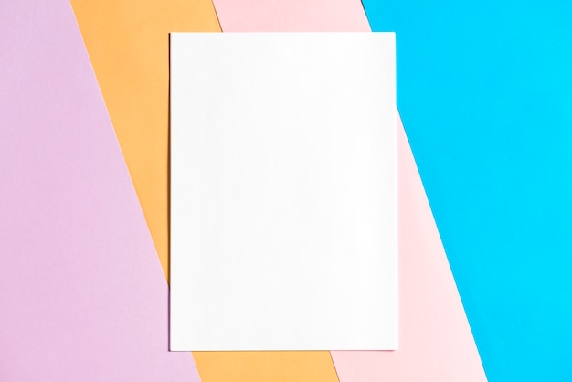 Blank paper on colorful papers background