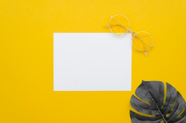 Blank paper sheet with leaf beside