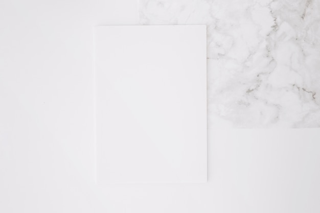 Free photo blank paper on white desk background