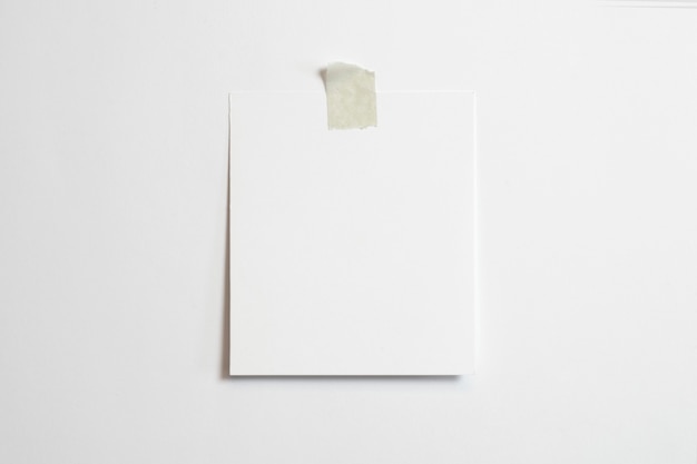 Free Photo blank photo frame with soft shadows and scotch tape isolated on white paper background 