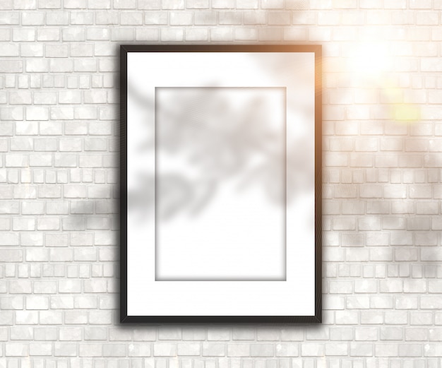 Free Photo  blank picture frame on brick wall with shadow and sunshine 