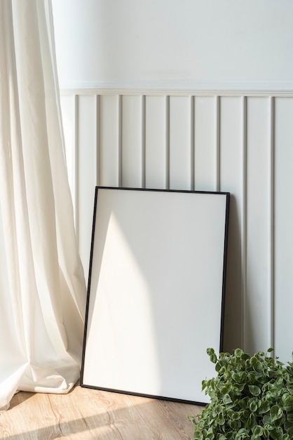 Blank picture frame on parquet floor