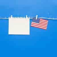 Free photo blank piece of paper and usa flag