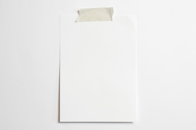 Free photo blank portrait photo frame 10 x 15 size with soft shadows  and scotch tape isolated on white paper background