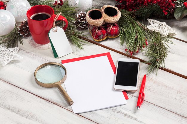 The blank sheet of paper on the wooden table with a pen