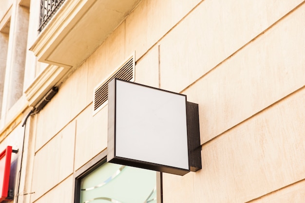 Blank square sign on wall