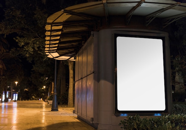 Free photo blank white advertisement panel in city