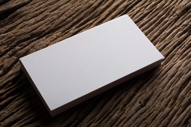 Free photo blank white business card presentation of corporate identity on wood background