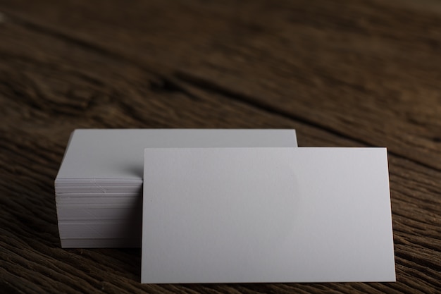 Free photo blank white business card presentation of corporate identity on wood background