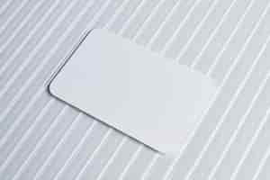 Free photo blank white card on pattern glass